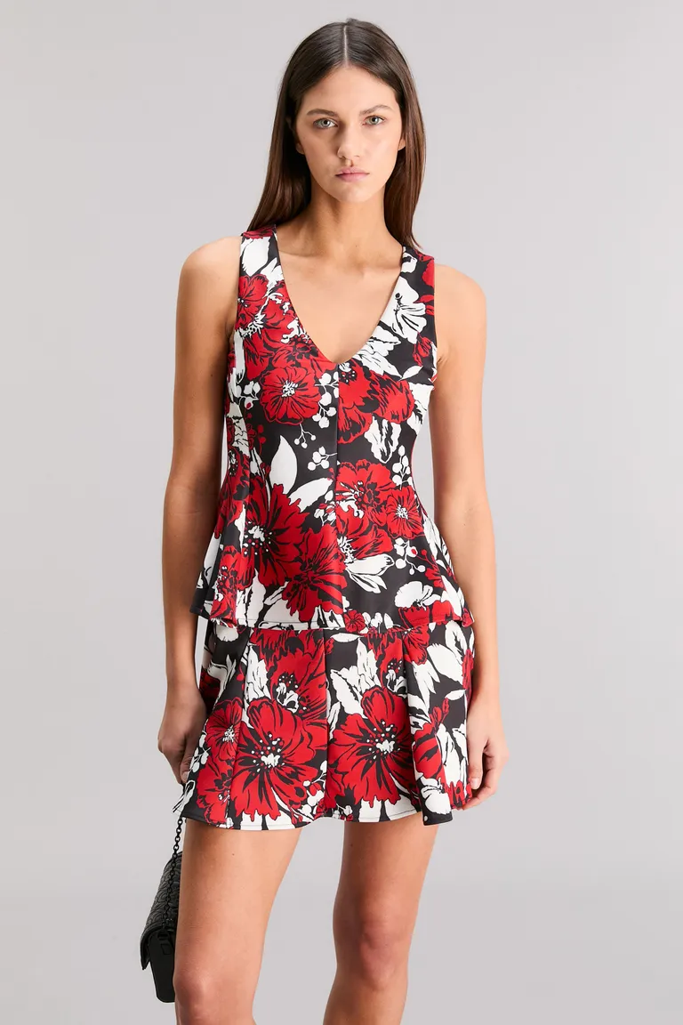 Top con corte peplum y estampado floral exclusivo para un look femenino y elegante de Kosiuko en Tops para argentina