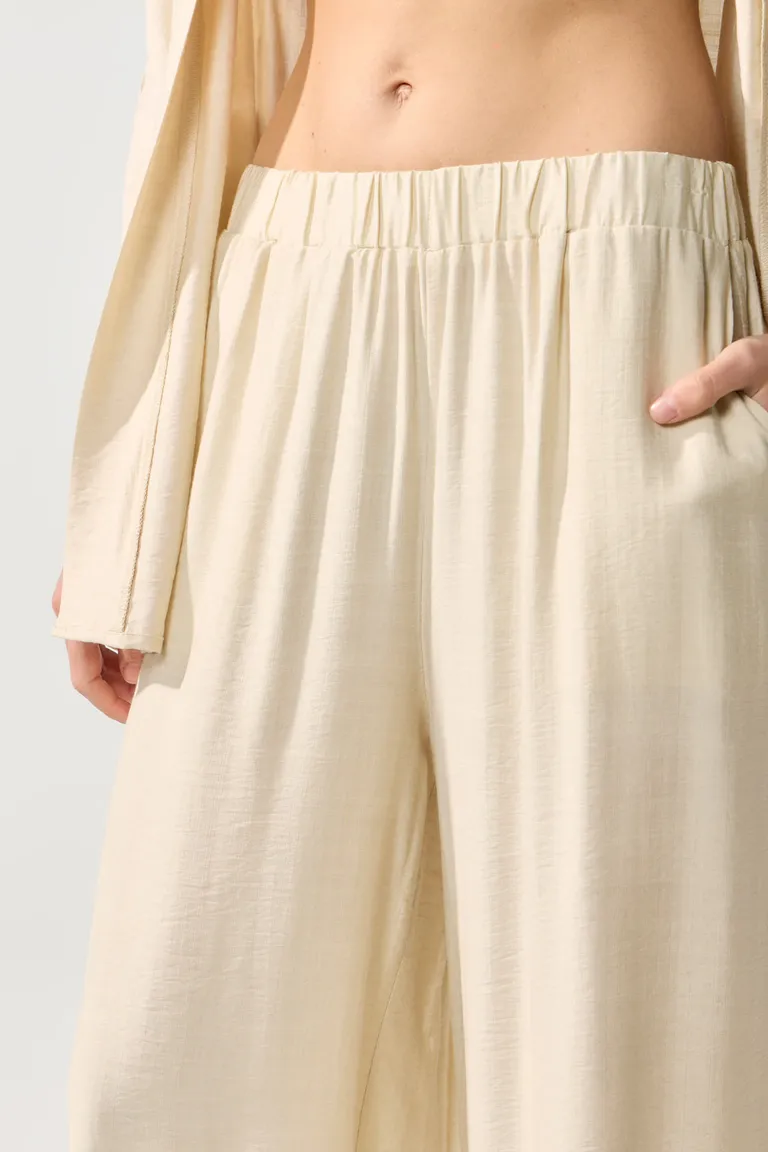 Pantalón de corte recto y cintura elástica en tono beige de Cuesta Blanca en Pantalones para argentina