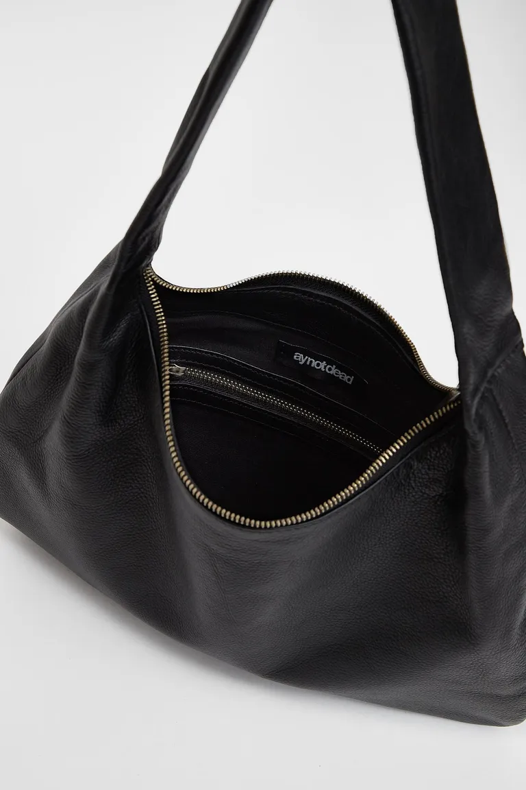 Cartera de cuero vacuno con diseño redondeado y correa fija para mujer de Ay Not Dead en Bolsos y Carteras para argentina