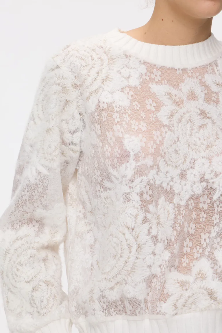 Sweater manga larga con encaje y motivos florales con terminaciones en punto ribb de Cuesta Blanca en Buzos y Sweaters para argentina