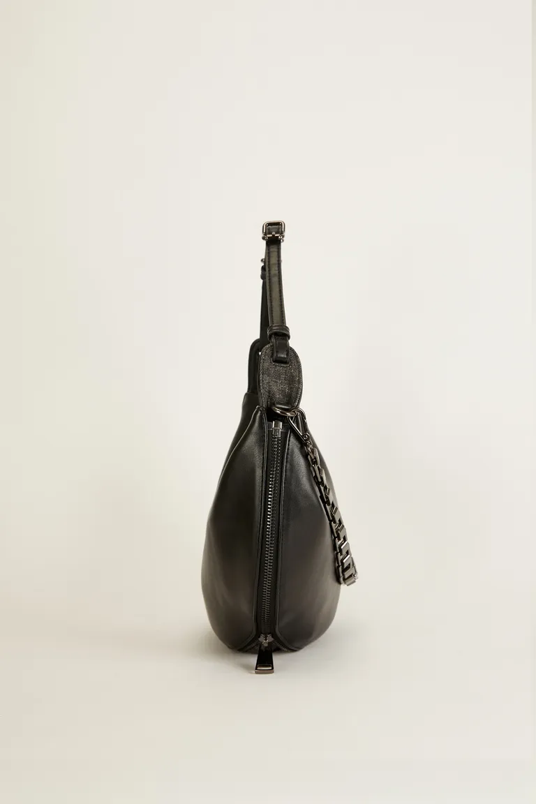 Cartera de cuero ecológico con cierre ajustable y detalles metálicos de Tucci en Bolsos y Carteras para argentina