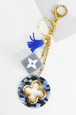 Dije flor cuatro hojas de Exotica Accesorios en Llaveros para argentina