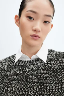 Sweater jaspeado cuello redondo de Mango en Buzos y Sweaters para argentina