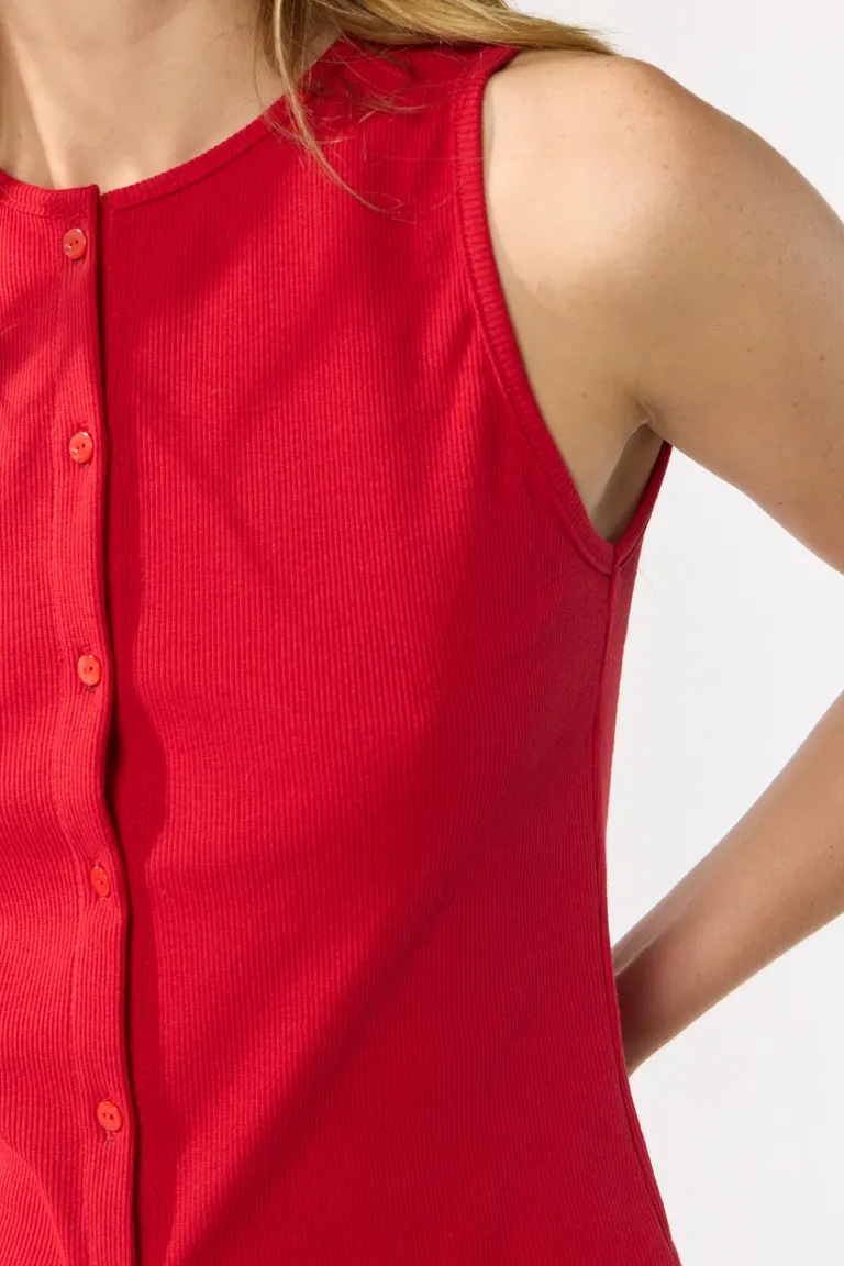 Top sin mangas con escote redondo y cierre de botones delanteros con ruedo en punta de Cuesta Blanca en Tops para argentina