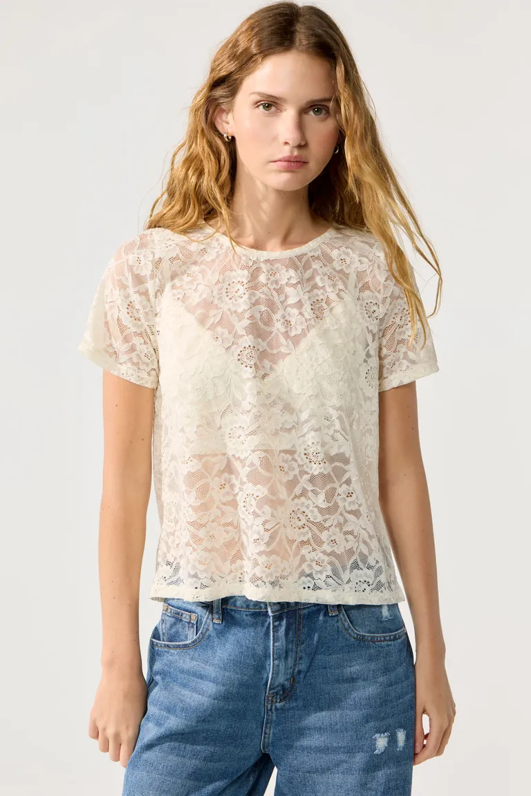 Blusa de encaje bordado con lentejuelas, escote redondo y abertura en la espalda de Cuesta Blanca en Blusas para argentina