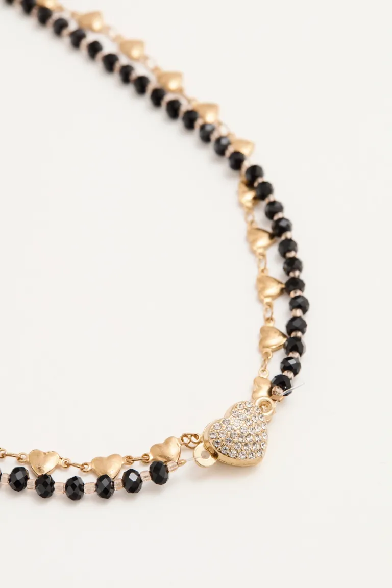 Collar de doble cadena con corazón magnético, una pieza elegante y versátil para realzar tu estilo de Rapsodia en Bijouterie para argentina