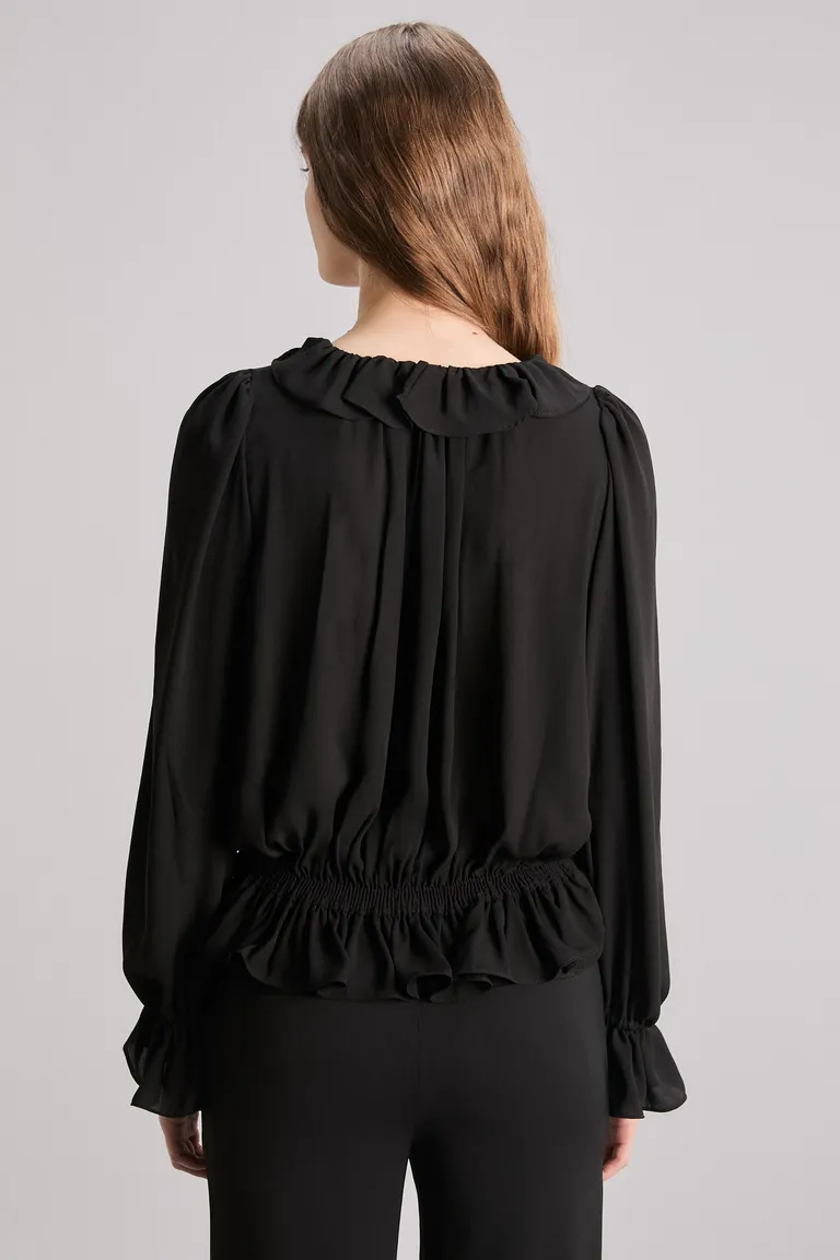 Blusa de seda con volados y lazo en cuello en color negro de Kosiuko en Blusas para argentina