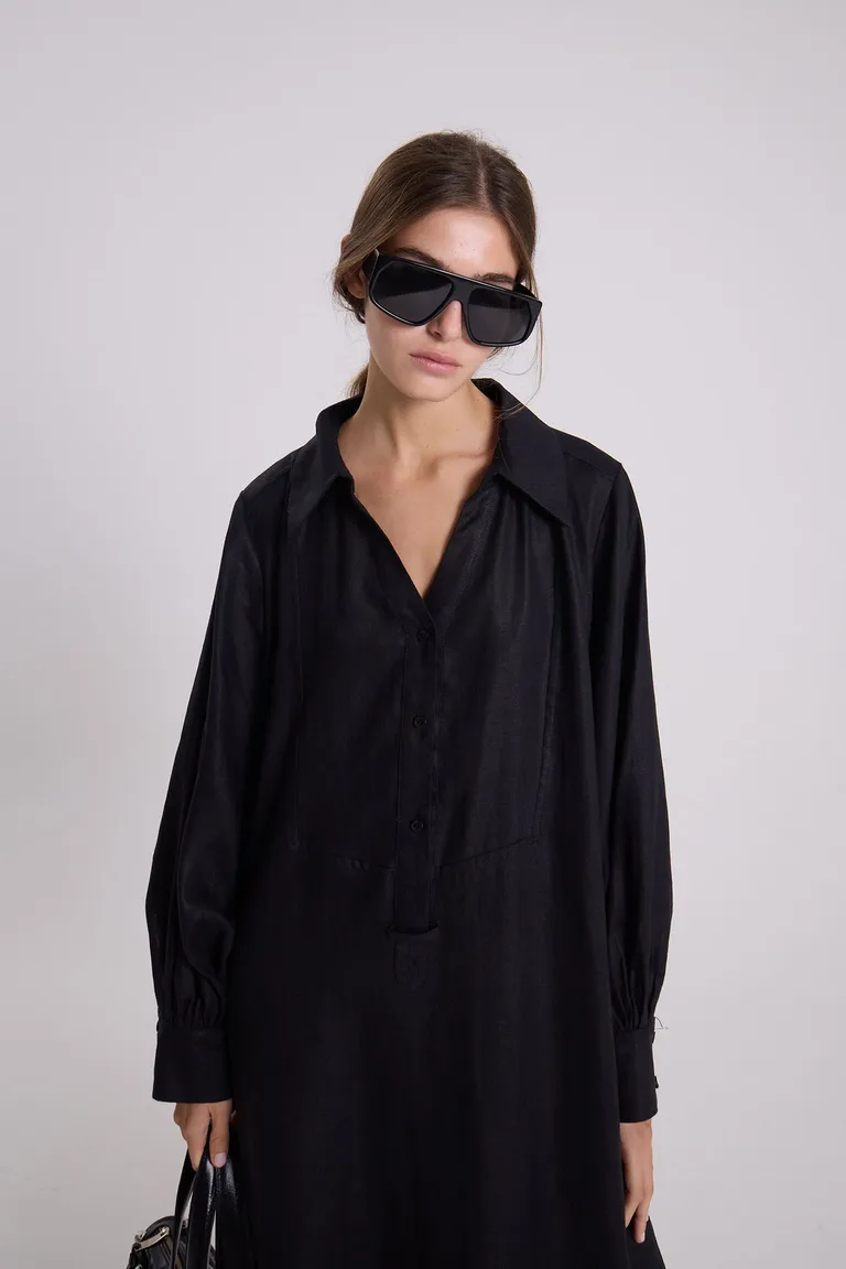Túnica de lino negro de corte holgado y mangas amplias para un look sofisticado de Maria Cher en Túnicas para argentina