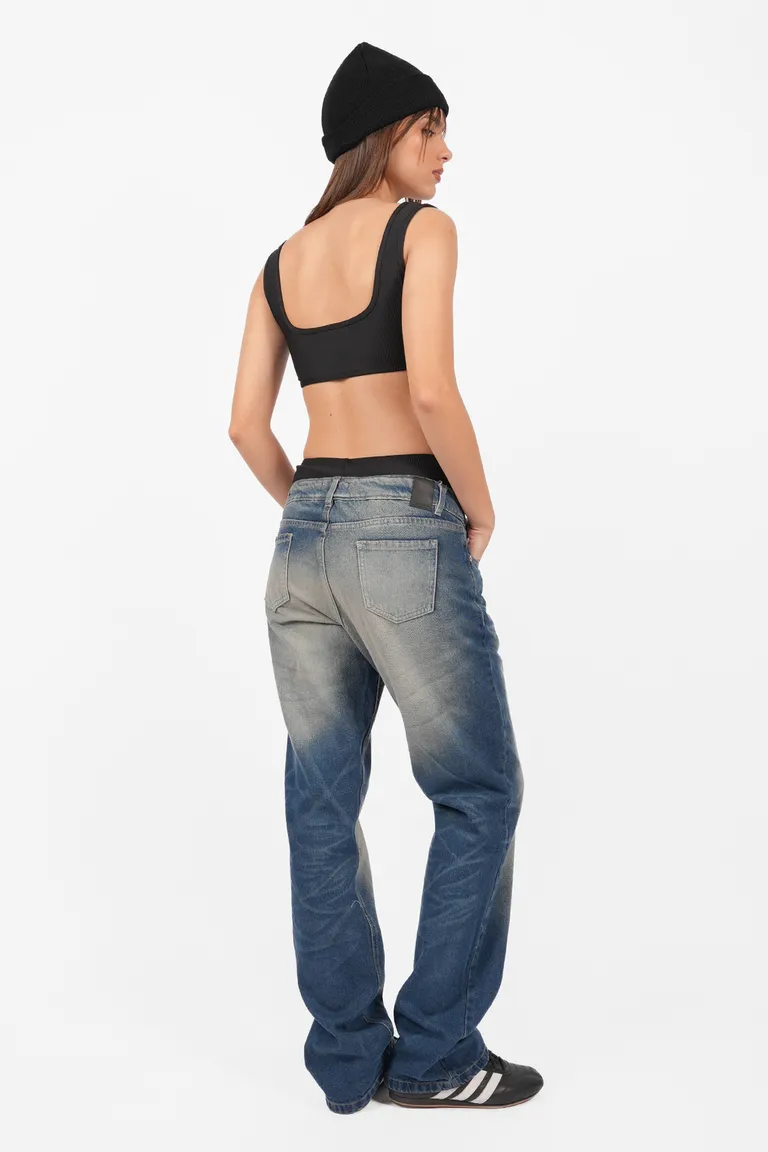 Pantalón denim de tiro bajo y pierna angosta con detalles artesanales de Top White en Pantalones para argentina