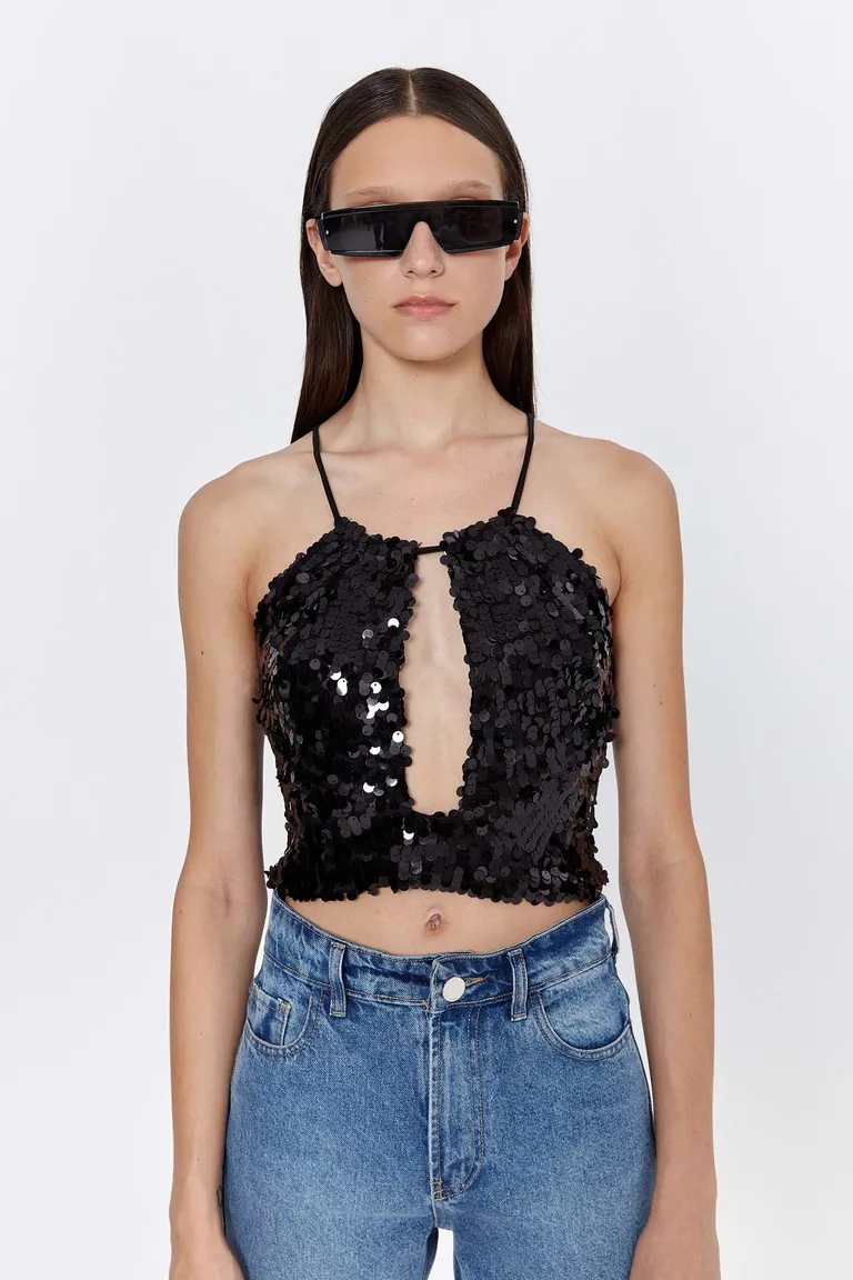 Top de lentejuelas negras con escote y buche en la espalda de Naíma en Tops para argentina