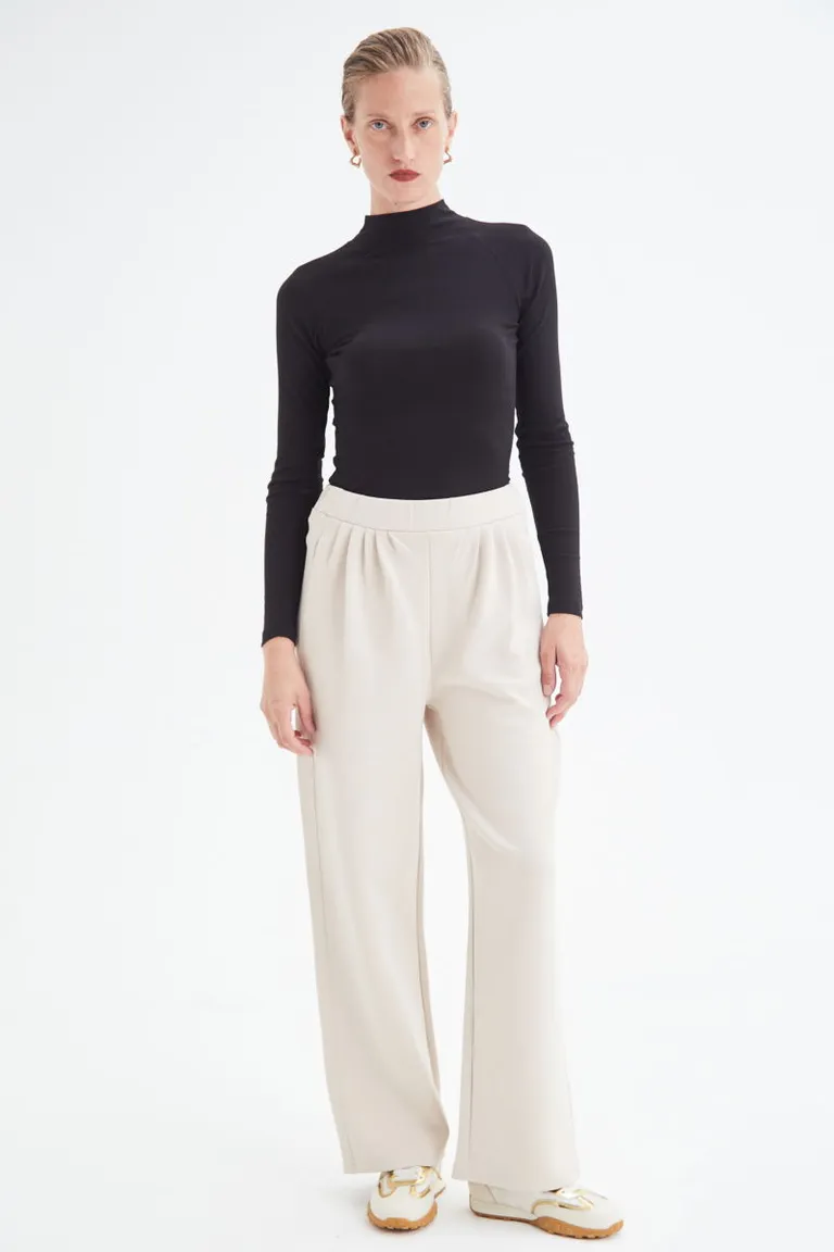Pantalón blanco de tiro medio con cintura elástica y bolsillos laterales de Las Pepas en Pantalones para argentina