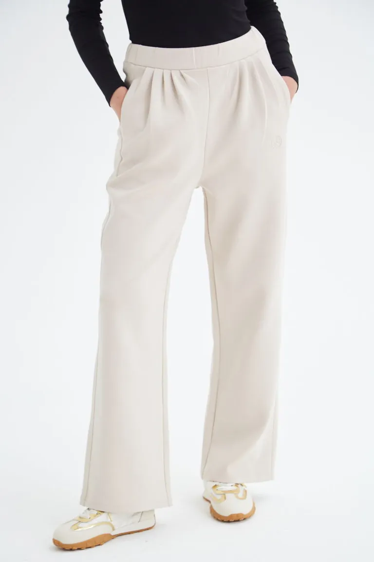 Pantalón blanco de tiro medio con cintura elástica y bolsillos laterales de Las Pepas en Pantalones para argentina