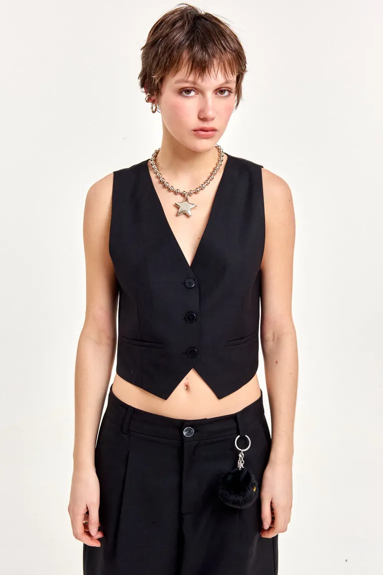 Chaleco sastre negro de diseño entallado y largo a la cintura para completar looks elegantes de 47 Street en Chalecos para argentina