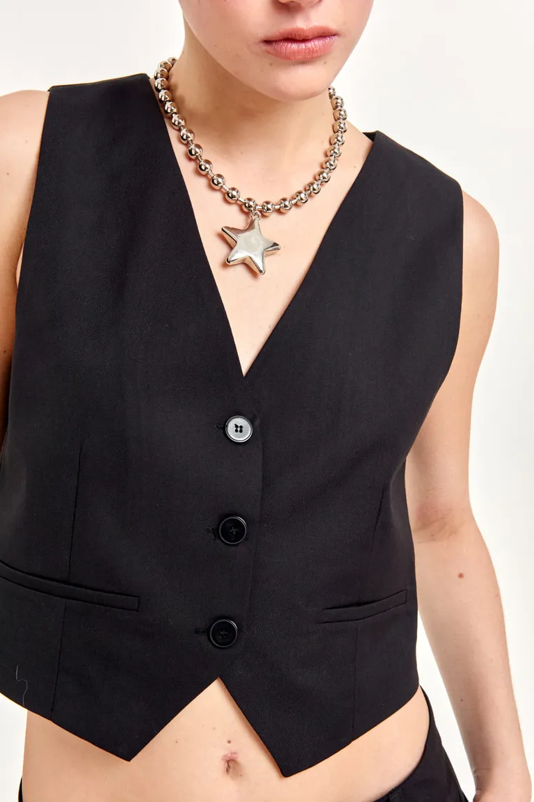 Chaleco sastre negro de diseño entallado y largo a la cintura para completar looks elegantes de 47 Street en Chalecos para argentina