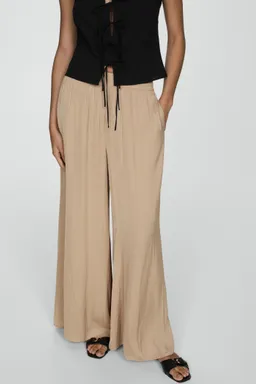 Pantalón fluido wideleg de Mango en Pantalones para argentina