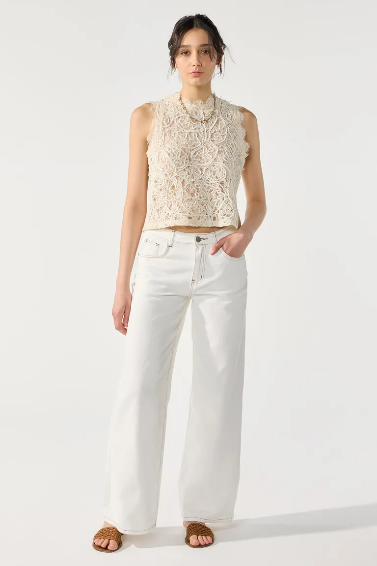 Pantalón de pierna ancha y tiro alto en acabado blanco con costuras en tono ocre de Cuesta Blanca en Pantalones para argentina