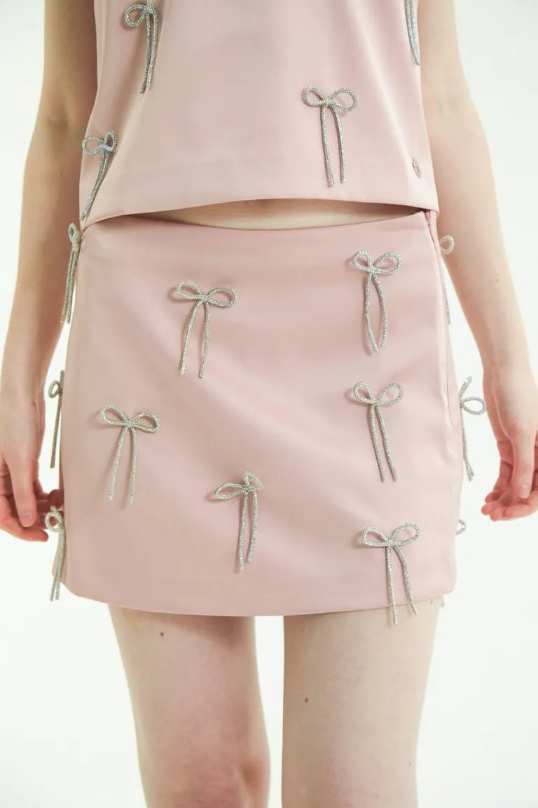 Falda satinada con moños brillantes - Pieza exclusiva y de alta calidad de Las Pepas en Faldas para argentina