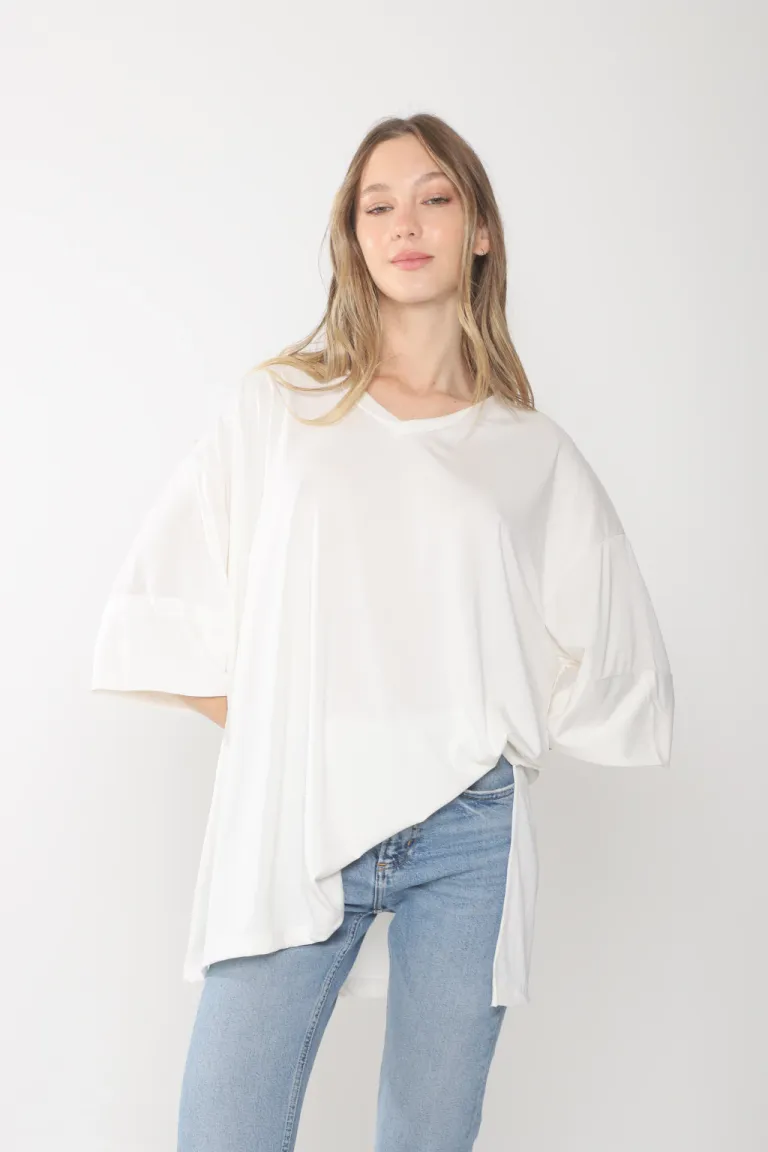 Remeron oversize de corte holgado y escote en V en tono blanco de Belle en Buzos y Sweaters para argentina