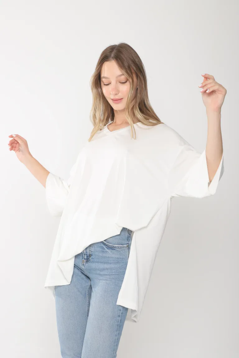 Remeron oversize de corte holgado y escote en V en tono blanco de Belle en Buzos y Sweaters para argentina