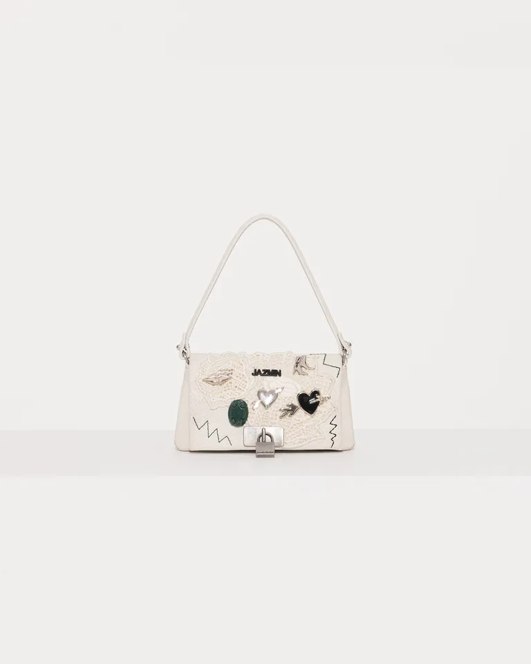 Bolso mini con detalles y aplicaciones en cuero blanco de Jazmin Chebar en Bolsos y Carteras para argentina