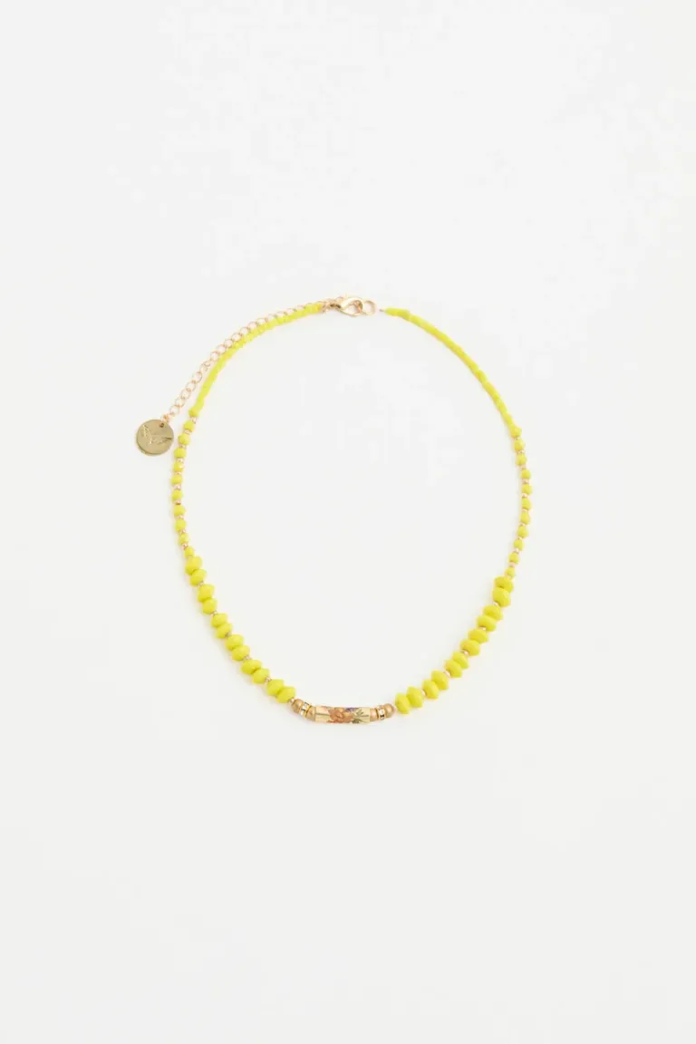 Collar corto con piezas pasantes y flor metálica, un accesorio de verano con personalidad de Rapsodia en Bijouterie para argentina