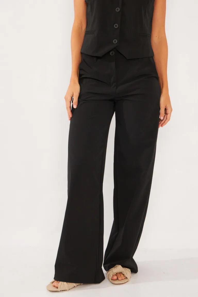 Pantalón sastre de corte amplio y pinzas, perfecto para looks formales y sofisticados de Belle en Pantalones para argentina