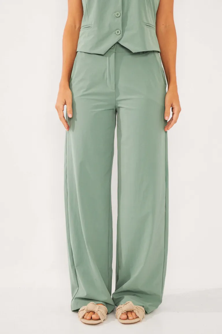 Pantalón sastre de corte amplio y pinzas, perfecto para looks formales y sofisticados de Belle en Pantalones para argentina