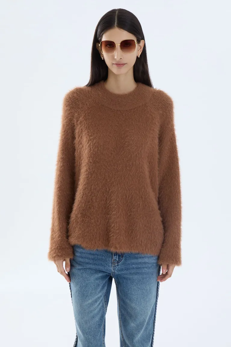 Sweater femenino con escote redondo, mangas raglán y diseño de calce recto de Portsaid en Buzos y Sweaters para argentina