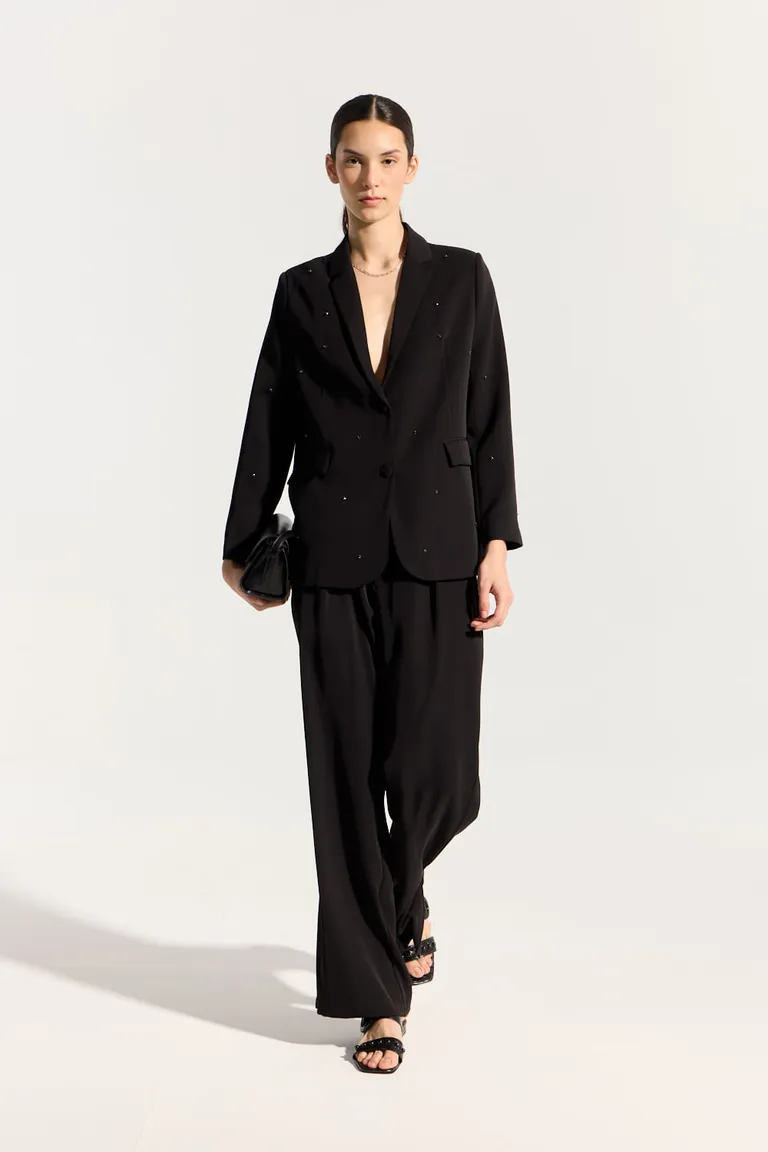 Pantalón negro de corte recto y pierna ancha con pinzas y detalles de tajo lateral de Portsaid en Pantalones para argentina