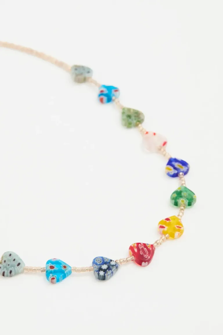 Collar corto con dijes de corazones multicolor decorativos de Rapsodia en Bijouterie para argentina