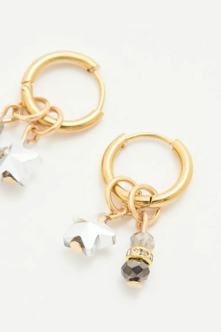 Aretes de argolla dorados con detalles en forma de estrella de cristal de Rapsodia en Bijouterie para argentina