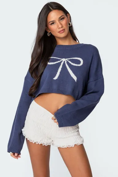 Sweater corto tejido con moño de undefined