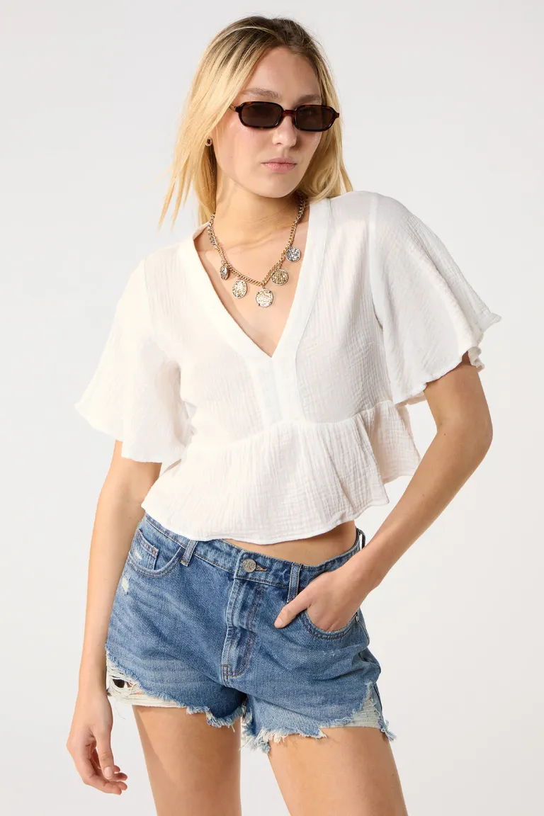 Blusa de algodón texturizado con mangas acampanadas, ideal para la temporada primavera-verano de Cuesta Blanca en Blusas para argentina