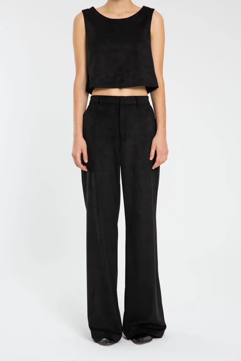 Pantalón sastre de gamuza negra con bolsillos laterales y cierre en cartera de Naíma en Pantalones para argentina