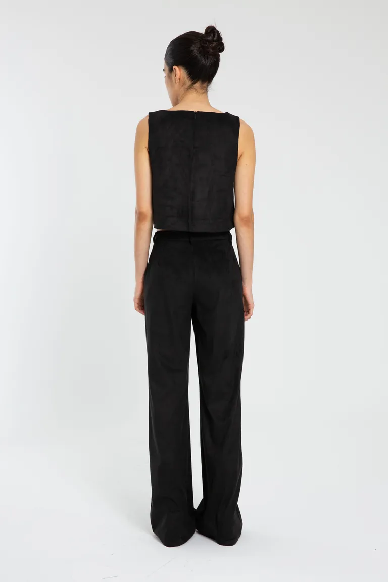 Pantalón sastre de gamuza negra con bolsillos laterales y cierre en cartera de Naíma en Pantalones para argentina