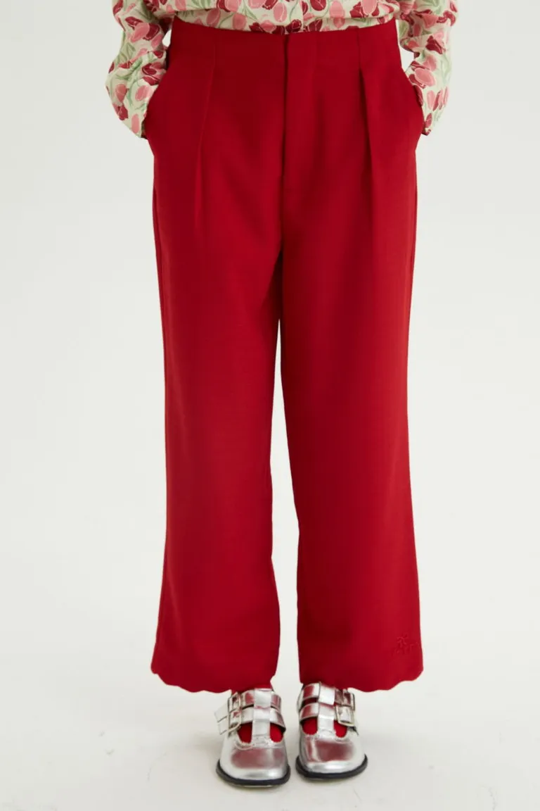 Pantalón sastrero de corte recto con pinzas delanteras, bolsillos laterales y detalle de ruedo ondulado bordado de Las Pepas en Pantalones para argentina