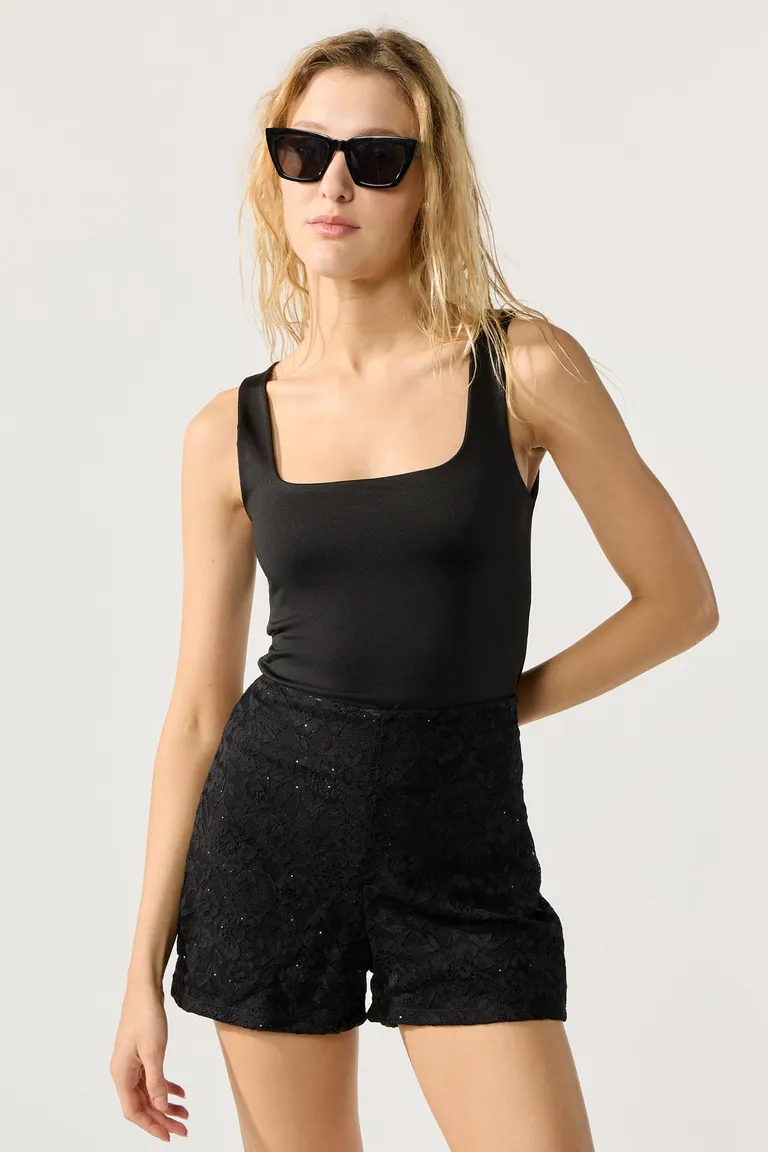 Top sin mangas negro de microfibra para mujer - Musculosa lisa de diseño sencillo y elegante de Cuesta Blanca en Tops para argentina