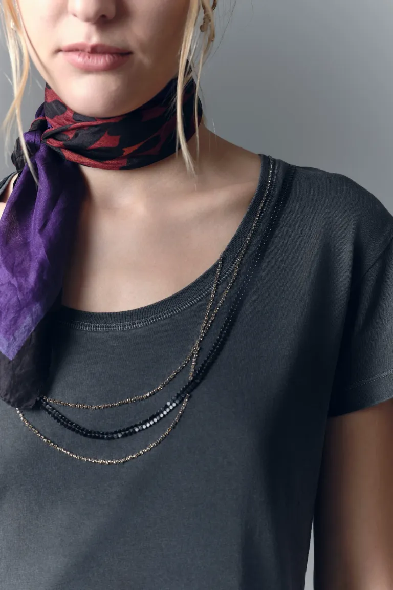 Remera de algodón con aplicaciones metálicas y detalles de strass de Rapsodia en Remeras para argentina