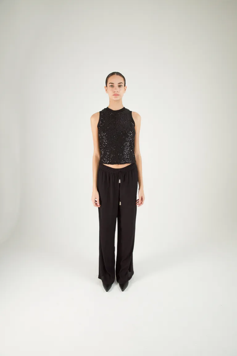 Pantalón negro de corte ancho y cintura elástica para mujer de Naíma en Pantalones para argentina