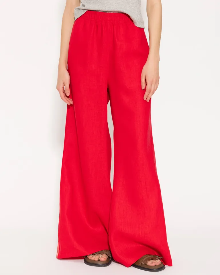 Pantalón ancho de lino en tono rojo, diseño cómodo y estiloso de Jazmin Chebar en Pantalones para argentina