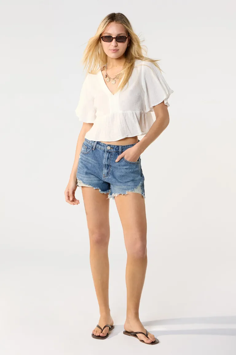 Shorts vaqueros de tiro alto con lavado y rotos en color azul de Cuesta Blanca en Shorts para argentina