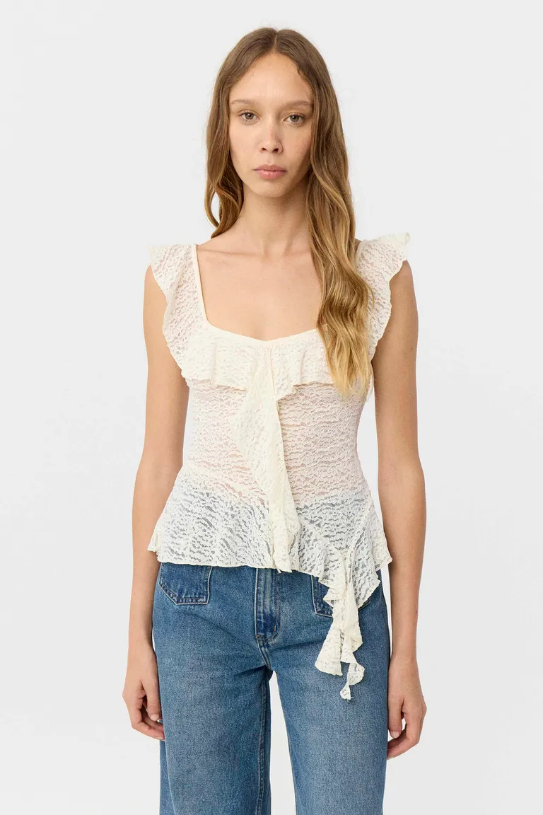 Top de encaje sin mangas con volados en escote y diseño asimétrico en ruedo de Markova en Tops para argentina