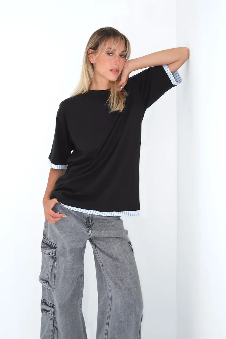 Remera negra oversize con detalles de rayas en mangas y bajo de Naíma en Buzos y Sweaters para argentina