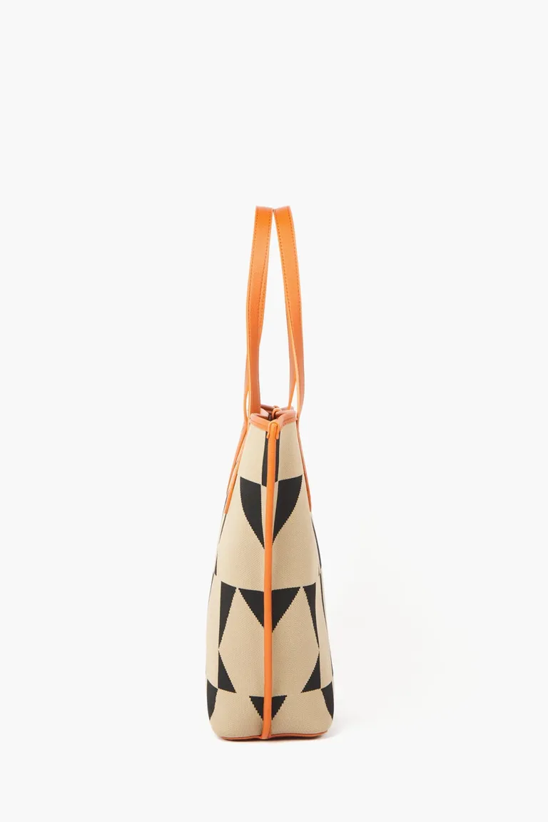 Bolso de mano con diseño geométrico y manijas fijas con cierre de broche imán de Mishka en Bolsos y Carteras para argentina