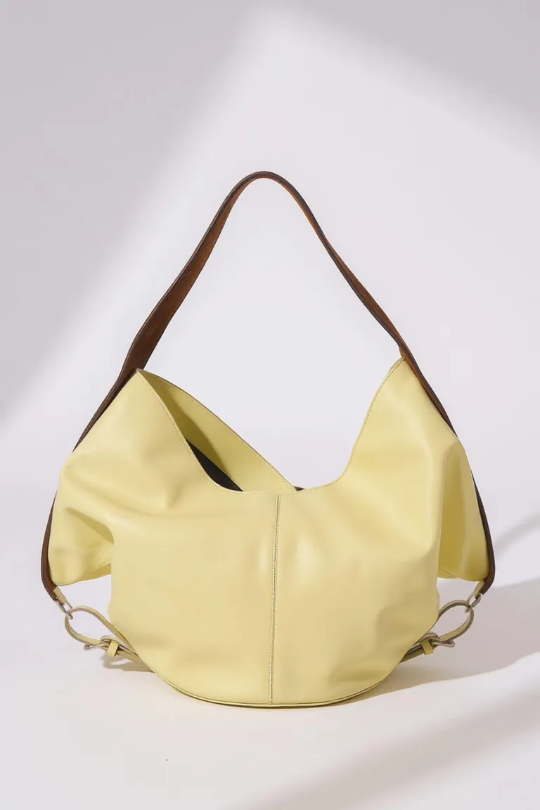 Cartera de Cuero Amarilla con Diseño Fluido y Manija de Gamuza Marrón de Maria Cher en Bolsos y Carteras para argentina
