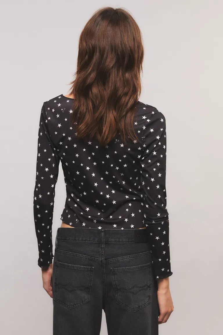 Top de manga larga con estampado de lunares y lazos en el delantero de Kosiuko en Tops para argentina