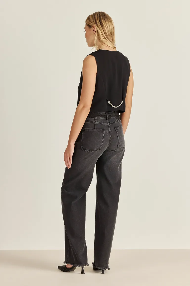 Pantalón de denim de tiro alto y corte wide leg con detalles metálicos en acabado negro de Tucci en Pantalones para argentina