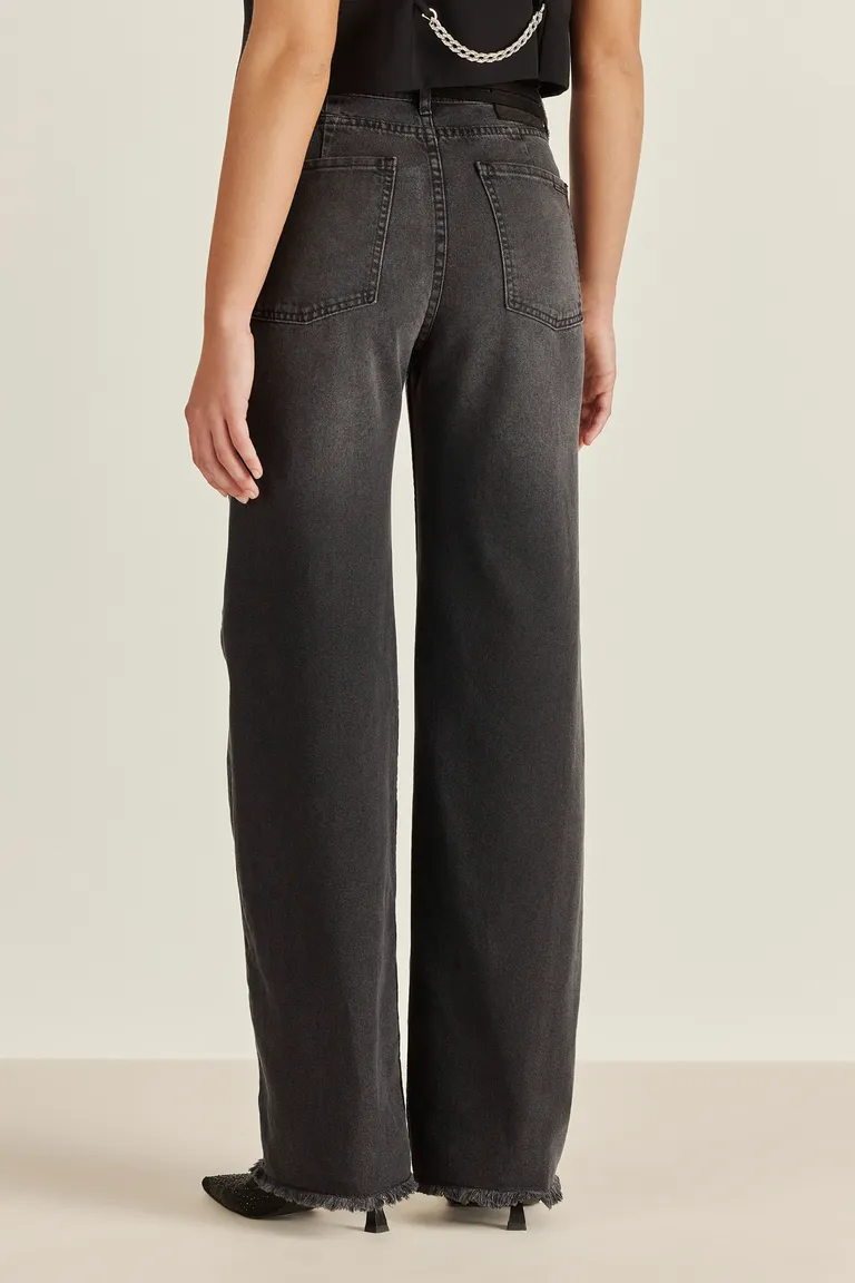 Pantalón de denim de tiro alto y corte wide leg con detalles metálicos en acabado negro de Tucci en Pantalones para argentina