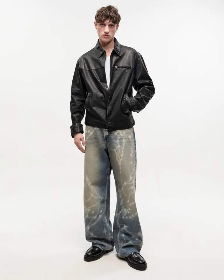 Pantalones de denim de corte ancho con estampado aéreo en tonos azules de Ay Not Dead en Pantalones para argentina