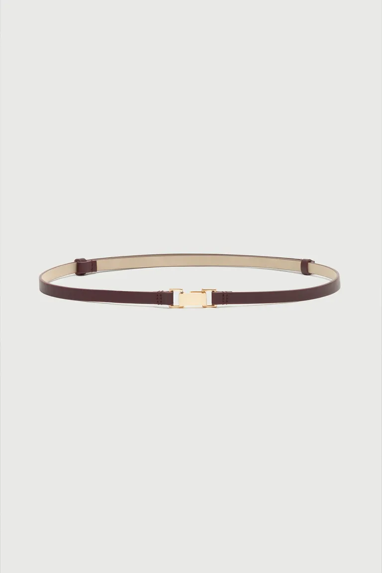 Cinturón de efecto cuero con hebilla metálica, perfecto para completar tus looks de Markova en Cinturones para argentina